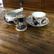 An English china teacup, saucer and milk jug, c.1830, with grape and vine leaf blue and white gilded