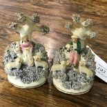 A pair of 19thc Staffordshire figures, Shepherd and Shepherdess, with flock (h.10cm)