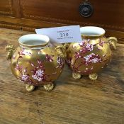 A pair of Coalport late 19thc miniature ovoid vases, with pink briar rose decoration and gilt