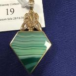 A 9ct gold double sided agate set pendant of polygon form, set green agate to one side, blue agate