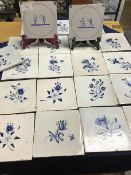 A collection of twenty two early 19thc blue delft tiles (each: 13cm x 13cm), twenty depicting single