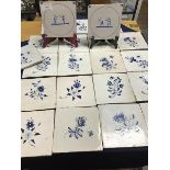 A collection of twenty two early 19thc blue delft tiles (each: 13cm x 13cm), twenty depicting single