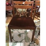 A Nathan Furniture 1970 set of four teak dining chairs with seat pads. (h.74cm x 48cm x 43cm)