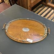 An oval oak twin handled gallery tray with Epns mounts, with central blank cartouche (63cm x 40cm)