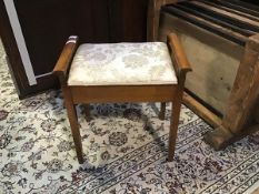A 20thc. hinged top piano stool on square supports (55cm x 53cm x 34cm)