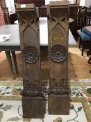 A pair of late 19thc carved pine mantle legs, the shaped corbal top with carved leaf and centre