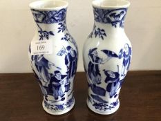 A pair of late 19thc Chinese blue and white exportware baluster vases, depicting tradesman and