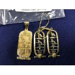 A pair of Egyptian design yellow metal earrings marked 975 together with a pendant of similar design