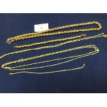 A group of yellow metal chains and bracelets, marked 9ct, including a rope necklace (50cm), bracelet