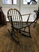 An Ercol spindle back chair model number CC41, with shaped seat on splay supports.