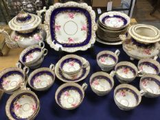 A late 19thc 27 piece tea set in the Coalport taste, with handpainted rose and floral decoration