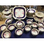 A late 19thc 27 piece tea set in the Coalport taste, with handpainted rose and floral decoration