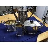 A four piece silver plated teaset, comprising teapot, hot water pot, sugar and cream with allover