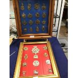 Two framed collections of British Military cap badges including numbered Glengarry badges, East