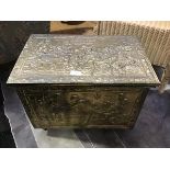 A brass covered wooden fireside bucket with embossed tavern scenes (38cm x 51cm x 34cm)