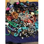 A mixed lot of jewellery comprising pendants, bead necklaces including polished hardstone, pebble