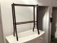 An Edwardian mahogany four bar towel rail