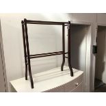 An Edwardian mahogany four bar towel rail