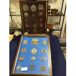 Two glazed frames: British Military badges, Scottish, Canadian etc., Royal Artillery, helmet