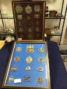 Two glazed frames: British Military badges, Scottish, Canadian etc., Royal Artillery, helmet