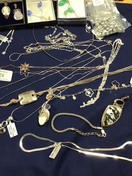 A mixed lot of jewellery including gem set pendants and necklaces, chain link bracelets, chains,