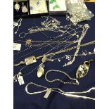 A mixed lot of jewellery including gem set pendants and necklaces, chain link bracelets, chains,