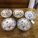 A mixed lot of plates including a Meissen blue and white ribbon plate, a pair of Ironstone Imari