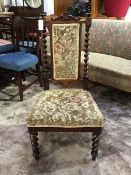 A 19thc rosewood hall chair, the carved back splat, supported on barley twist columns, with