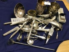 A mixed lot of silver plate including two Christening mugs (h.9cm), nutcracks, jam spoons, candle