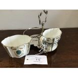 A Wedgwood china scalloped sugar and cream with floral decoration complete with silver plated stand,