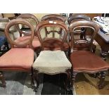 A harlequin set of six Victorian balloon back dining chairs, composed of a set of three chairs, a