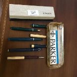 A group of three Parker fountain pens and one pencil, one with 14ct gold nib