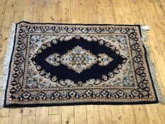 An Iranian Shiran style rug, the panel with central shaped medallion enclosed within a lotus