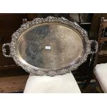 A Sheffield plate twin handled tray with cast handles with grape leaf and vine decoration, the