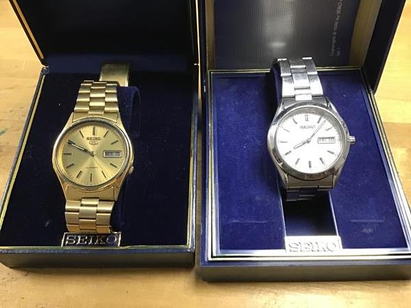 Two cased Seiko gentleman's wristwatches; a gold plated automatic wristwatch on gold plated strap (