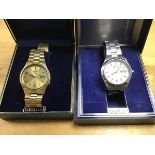 Two cased Seiko gentleman's wristwatches; a gold plated automatic wristwatch on gold plated strap (