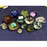 A collection of glass paperweights including six Caithness paperweights (tallest: 10cm) together