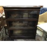 An Edwardian mahogany Globe Wernicke three section, sectional bookcase, the plain top above three