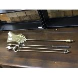 A set of three brass urn top fireirons in the 19thc. style