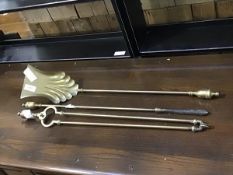 A set of three brass urn top fireirons in the 19thc. style