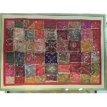 A decorative Indian patchwork panel of cotton and gauze, with allover wire and silk embroidery, with
