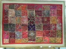 A decorative Indian patchwork panel of cotton and gauze, with allover wire and silk embroidery, with