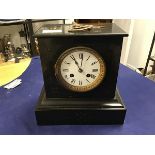 A 19thc slate mantle clock, the rectangular top above a circular white enamelled dial with roman