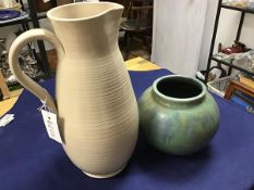 A large glazed pottery ribbed water jug (h.33cm) together with a mottled green glaze Upchurch