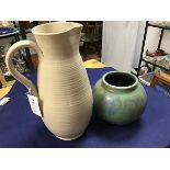 A large glazed pottery ribbed water jug (h.33cm) together with a mottled green glaze Upchurch