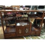 A Chinese cherrywood display stand, the rectangular top with mother of pearl inlay, above twin