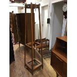 A 1920's oak hat and coat stand, of squarer tapered form, the top with bronzed hooks, with