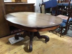 A 19thc Continental mahogany dining table, the oval scalloped top, raised on a spiral turned