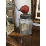 A British made butter churn with hand driven mechanism to top, with steel lid, wooden churn on glass