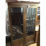 A 19thc mahogany bookcase cabinet, the moulded cornice above a pair of astragal glazed doors